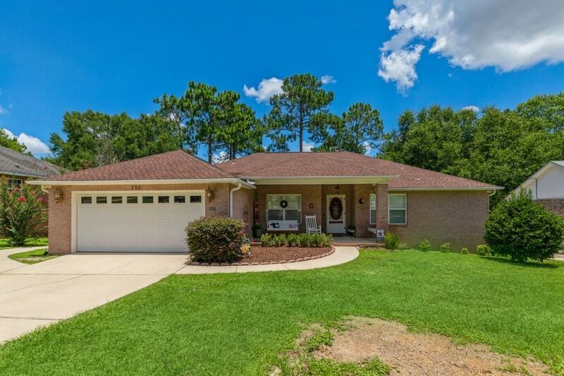 720 Riva Ridge Drive Crestview, FL 32539 - Photo 1 of 36 a view of a house with garden and a yard
