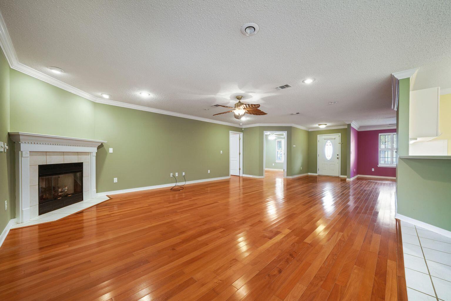 720 Riva Ridge Drive Crestview, FL 32539 - Photo 11 of 36 a view of an empty room with window and wooden floor