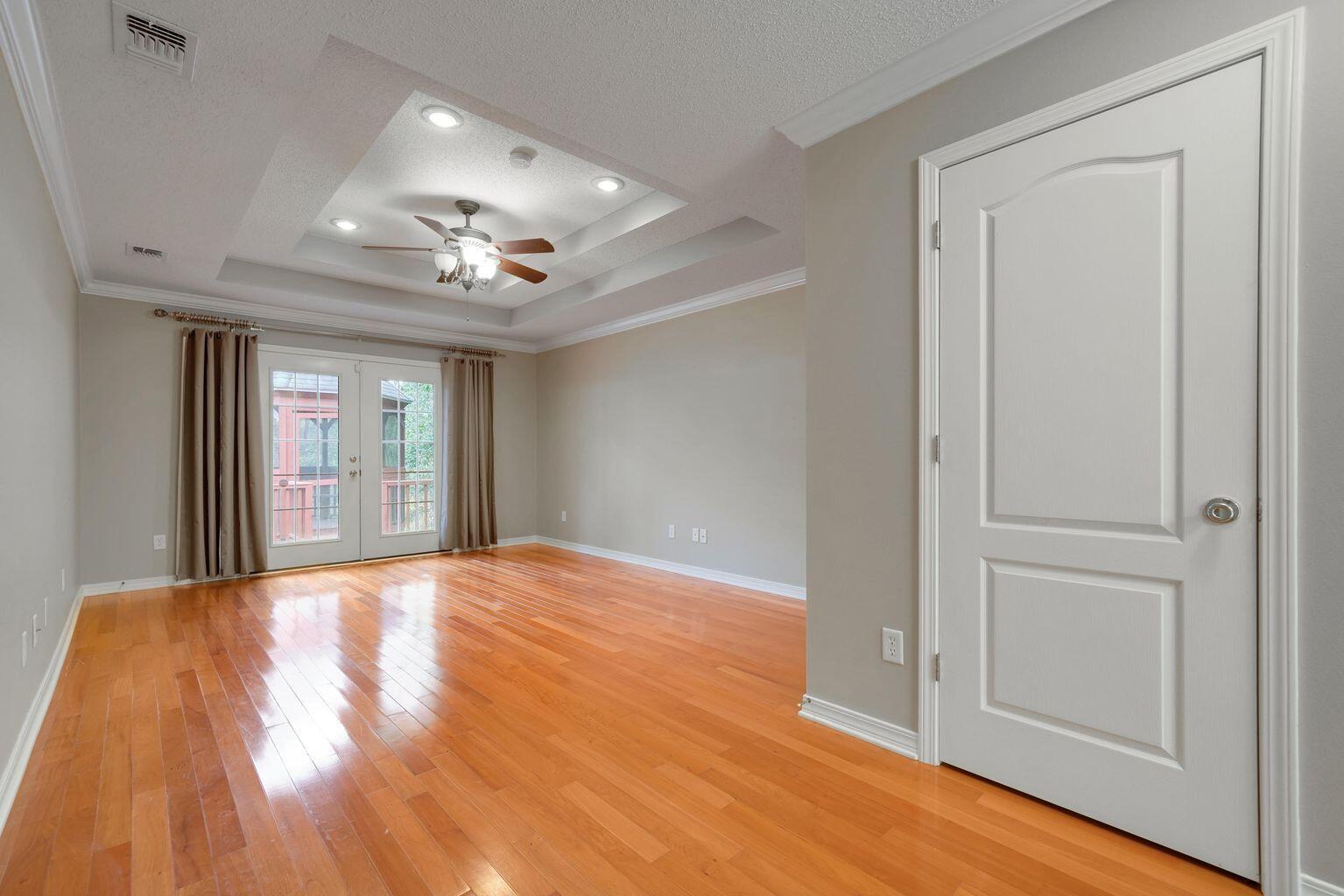 720 Riva Ridge Drive Crestview, FL 32539 - Photo 20 of 36 a view of an empty room with window and wooden floor