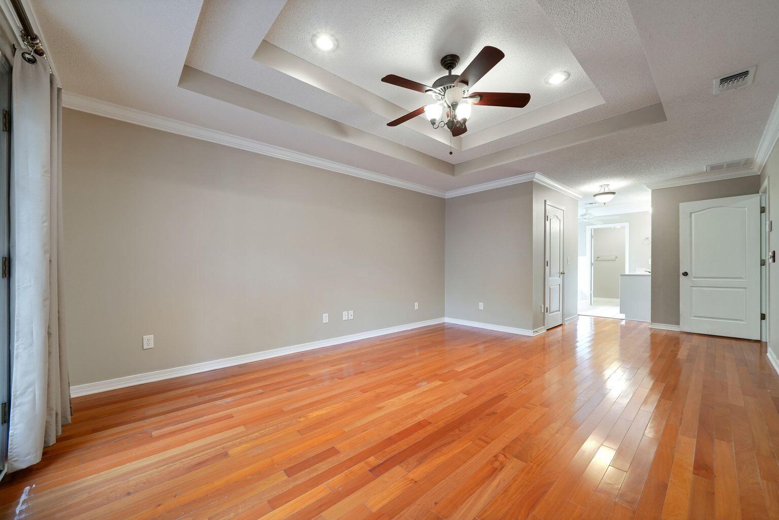 720 Riva Ridge Drive Crestview, FL 32539 - Photo 21 of 36 a view of an empty room and wooden floor