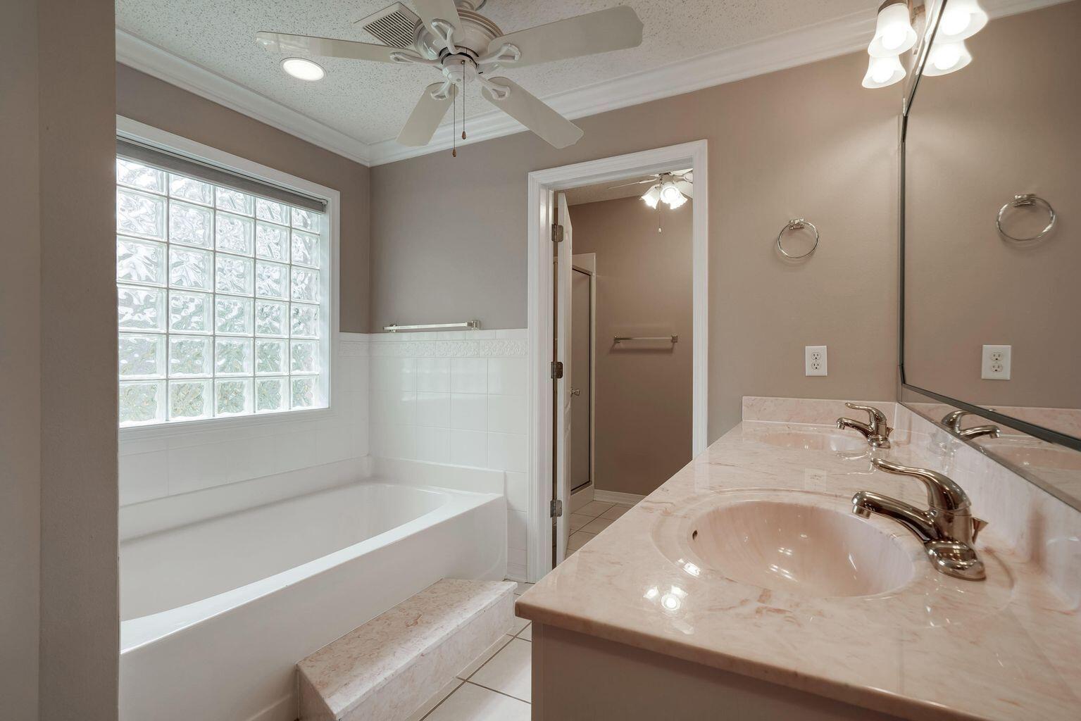 720 Riva Ridge Drive Crestview, FL 32539 - Photo 22 of 36 a bathroom with a sink and a bathtub