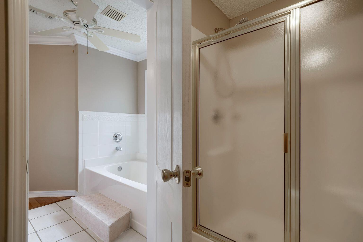720 Riva Ridge Drive Crestview, FL 32539 - Photo 23 of 36 a bathroom with a bathtub and a shower