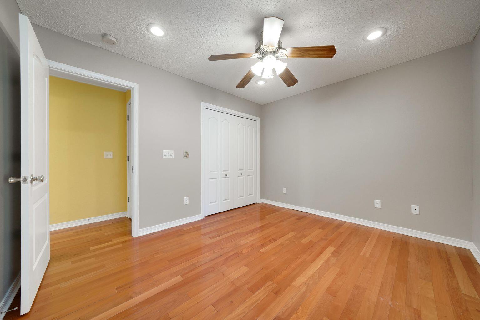 720 Riva Ridge Drive Crestview, FL 32539 - Photo 27 of 36 wooden floor in an empty room with a window