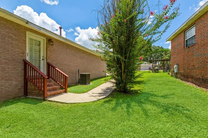 720 Riva Ridge Drive Crestview, FL 32539 - Photo 28 of 36 a view of a house with a yard