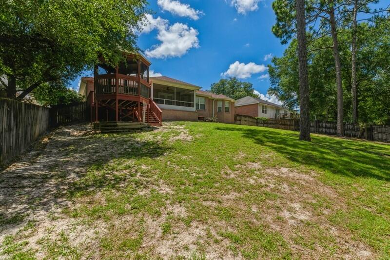720 Riva Ridge Drive Crestview, FL 32539 - Photo 33 of 36 a front view of a house with a yard