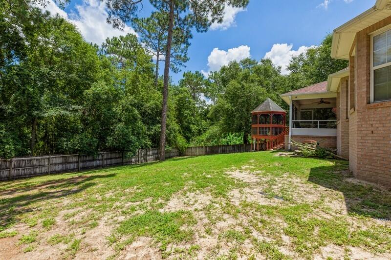 720 Riva Ridge Drive Crestview, FL 32539 - Photo 35 of 36 a view of a house with backyard and sitting area