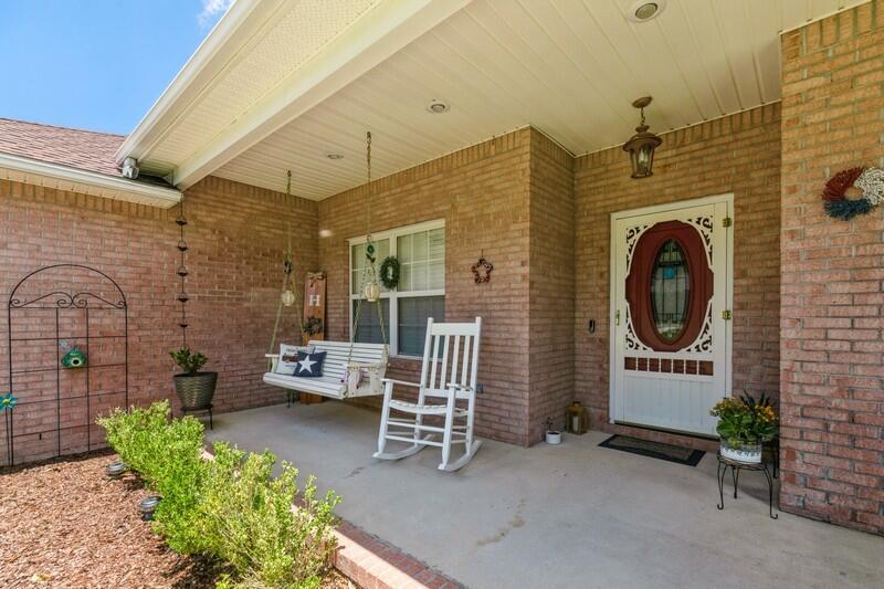720 Riva Ridge Drive Crestview, FL 32539 - Photo 4 of 36 a view of a patio with a table and chairs