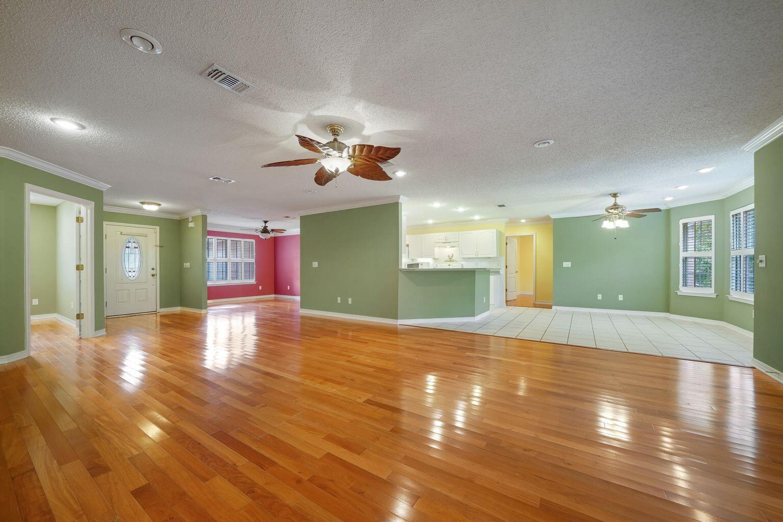 720 Riva Ridge Drive Crestview, FL 32539 - Photo 10 of 36 a view of empty room with wooden floor and window