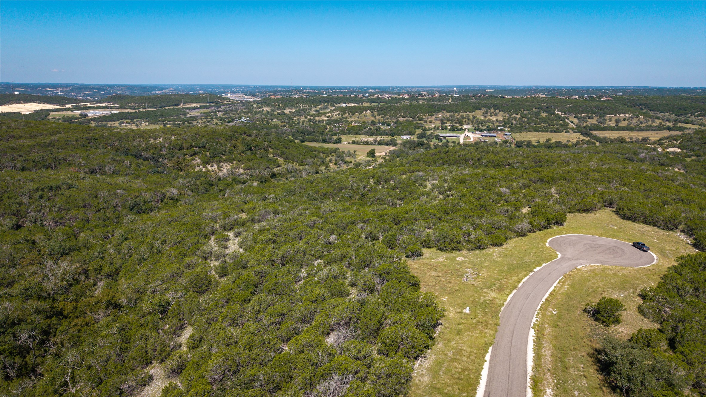 View of property location featuring a heavily wooded area