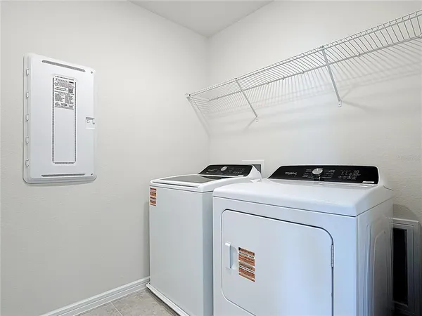 a utility room with dryer and washer
