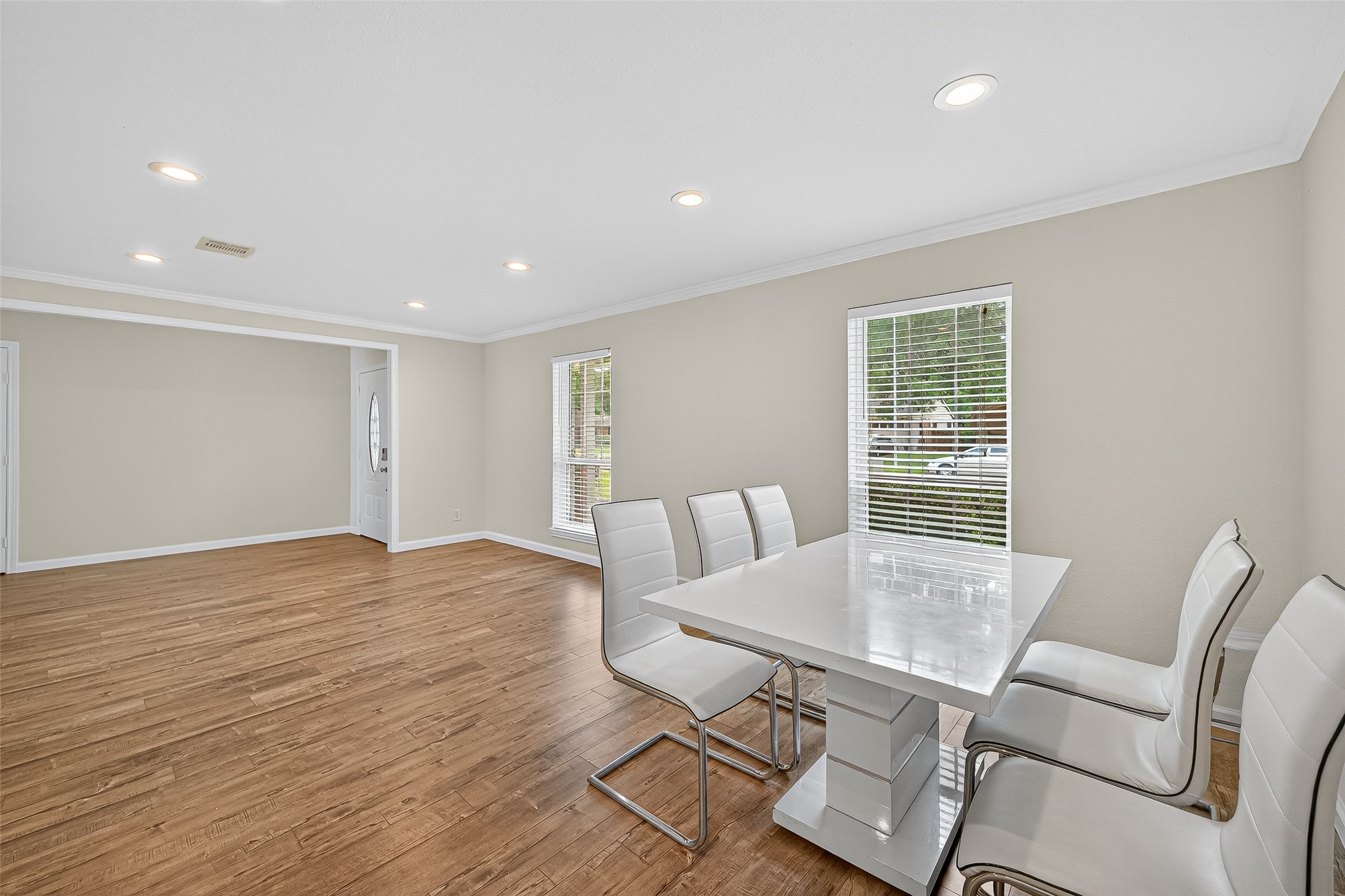 8530 Roos Road Houston, TX 77036 - Photo 12 of 43 a view of a dining room with furniture and wooden floor