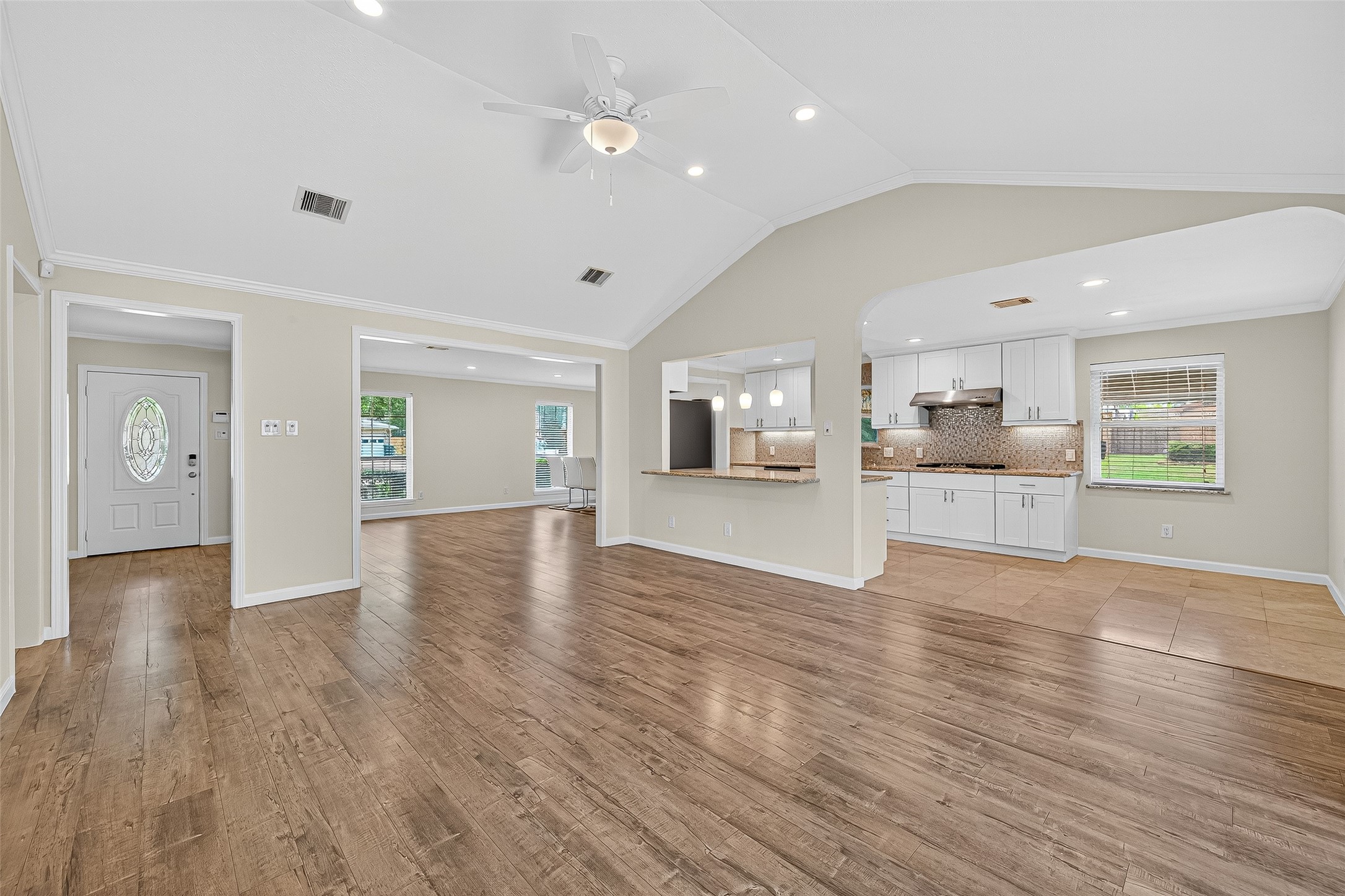 8530 Roos Road Houston, TX 77036 - Photo 14 of 43 a view of a kitchen with wooden floor and a window