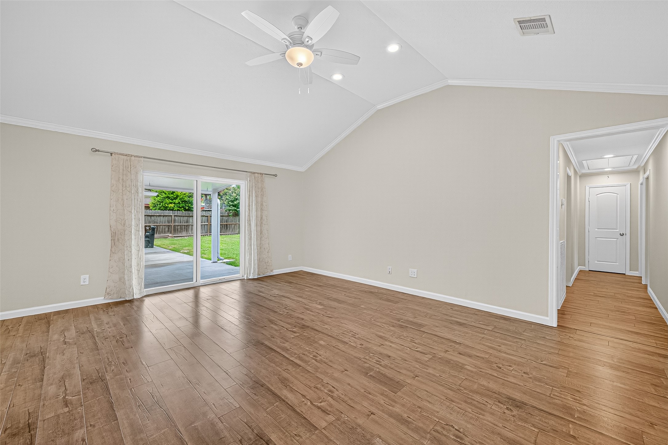 8530 Roos Road Houston, TX 77036 - Photo 16 of 43 a view of an empty room with wooden floor and a window
