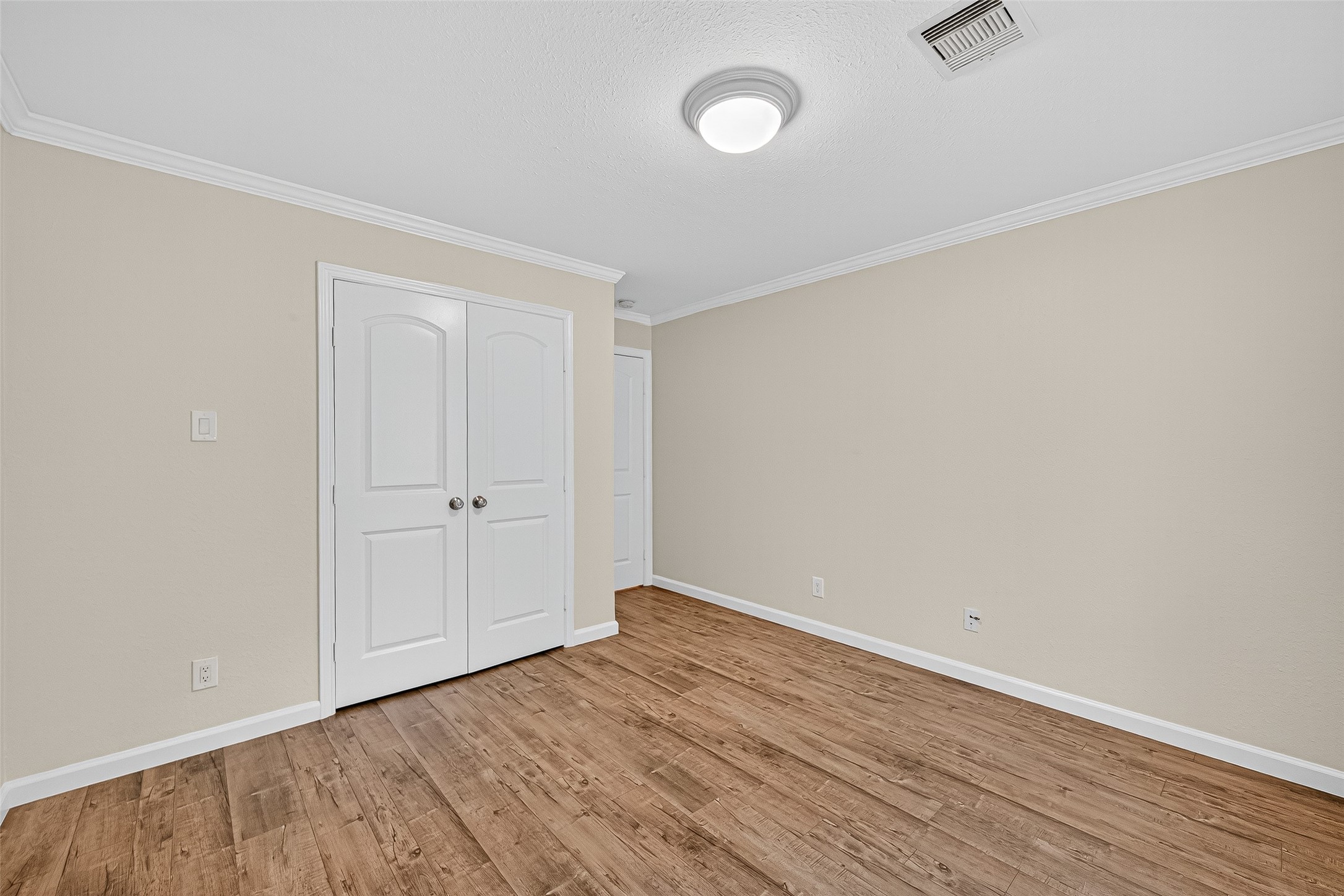8530 Roos Road Houston, TX 77036 - Photo 30 of 43 a view of an empty room with wooden floor and a window