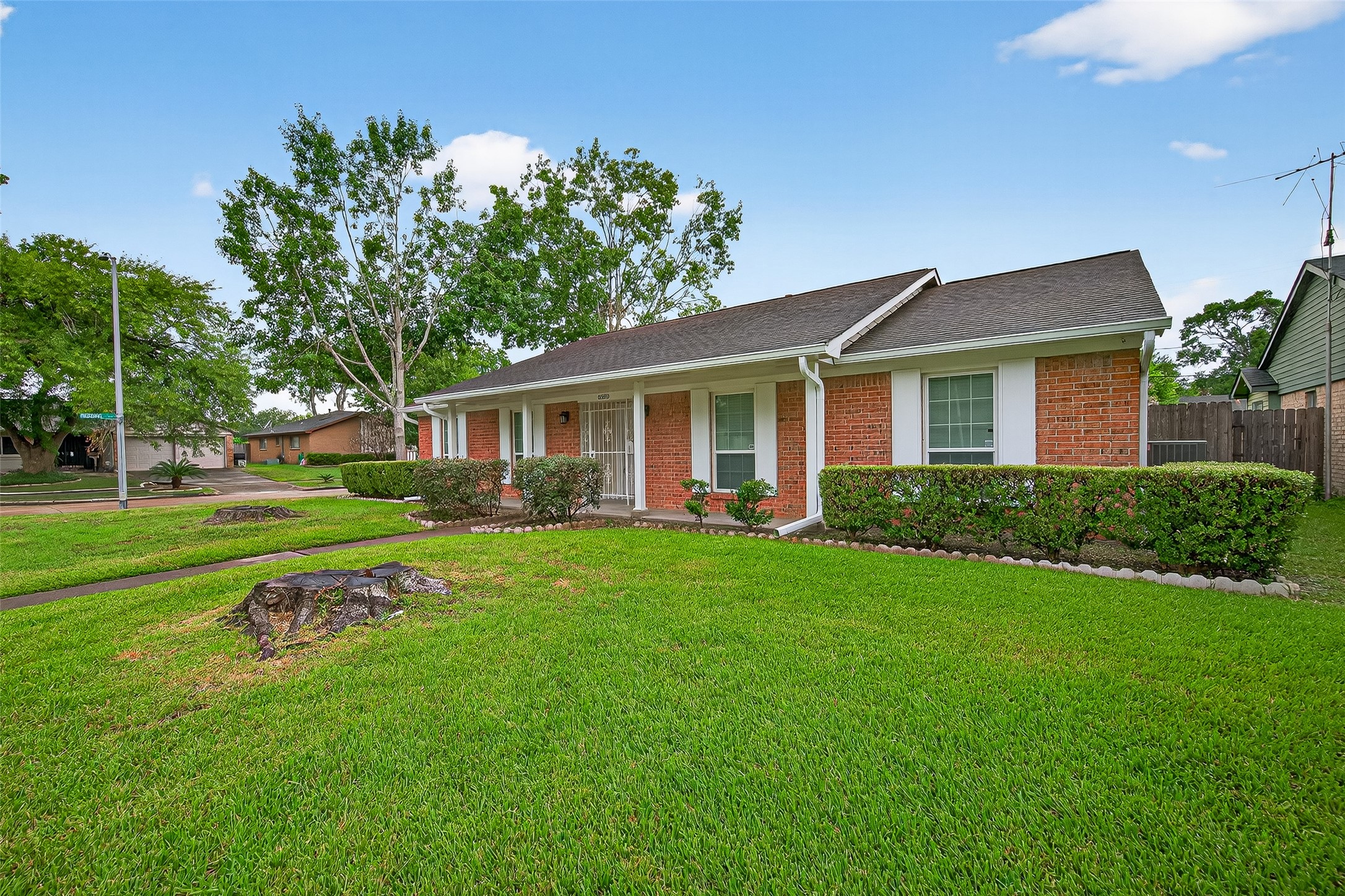 8530 Roos Road Houston, TX 77036 - Photo 3 of 43 a front view of a house with a yard