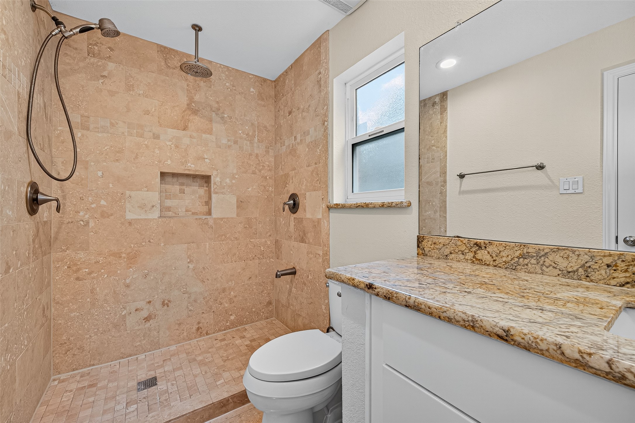 8530 Roos Road Houston, TX 77036 - Photo 36 of 43 a bathroom with a granite countertop sink toilet and shower