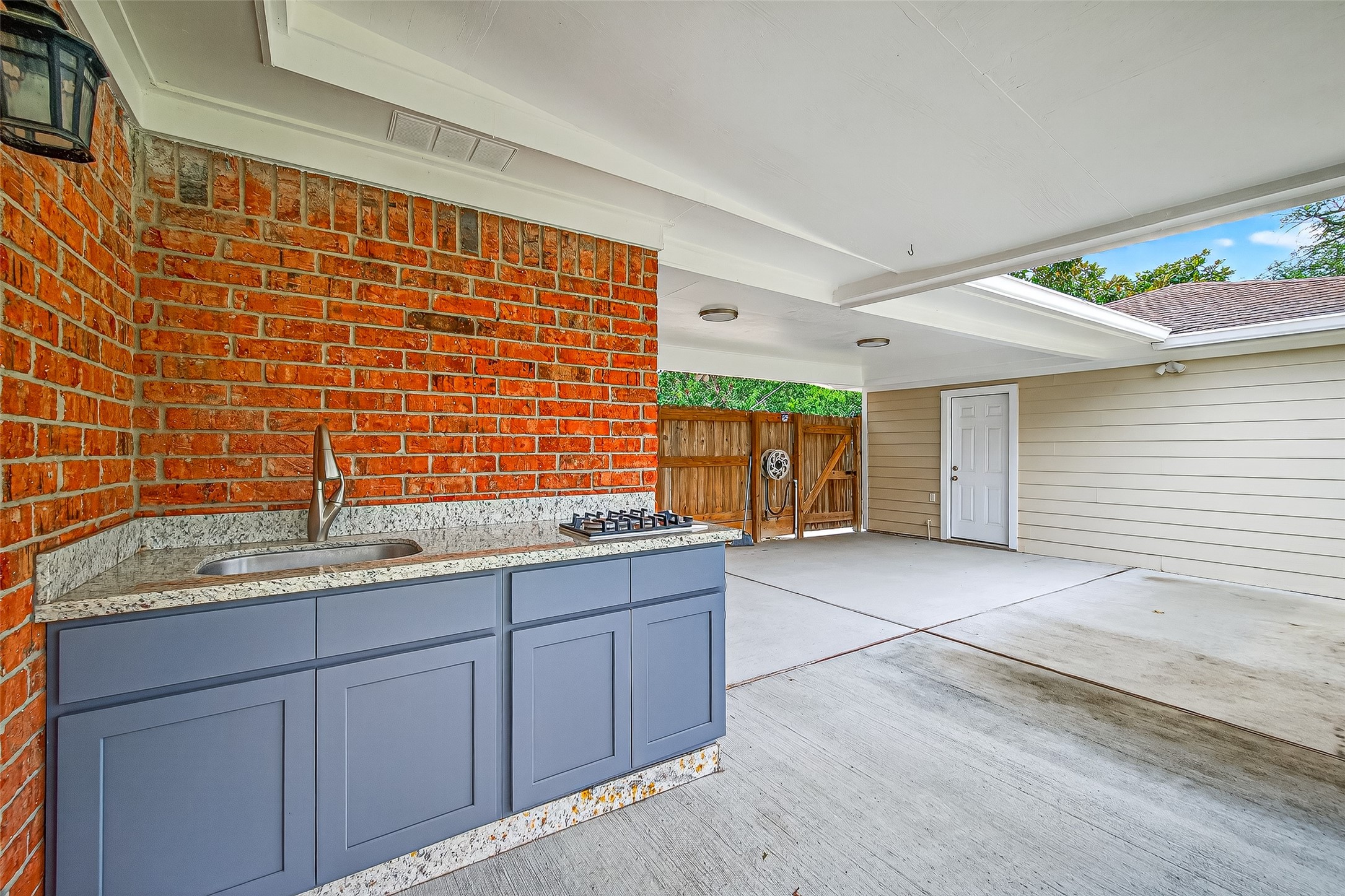 8530 Roos Road Houston, TX 77036 - Photo 37 of 43 a bathroom with a granite countertop sink and a shower