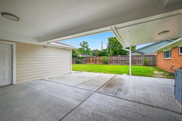 a view of a house with a backyard and porch