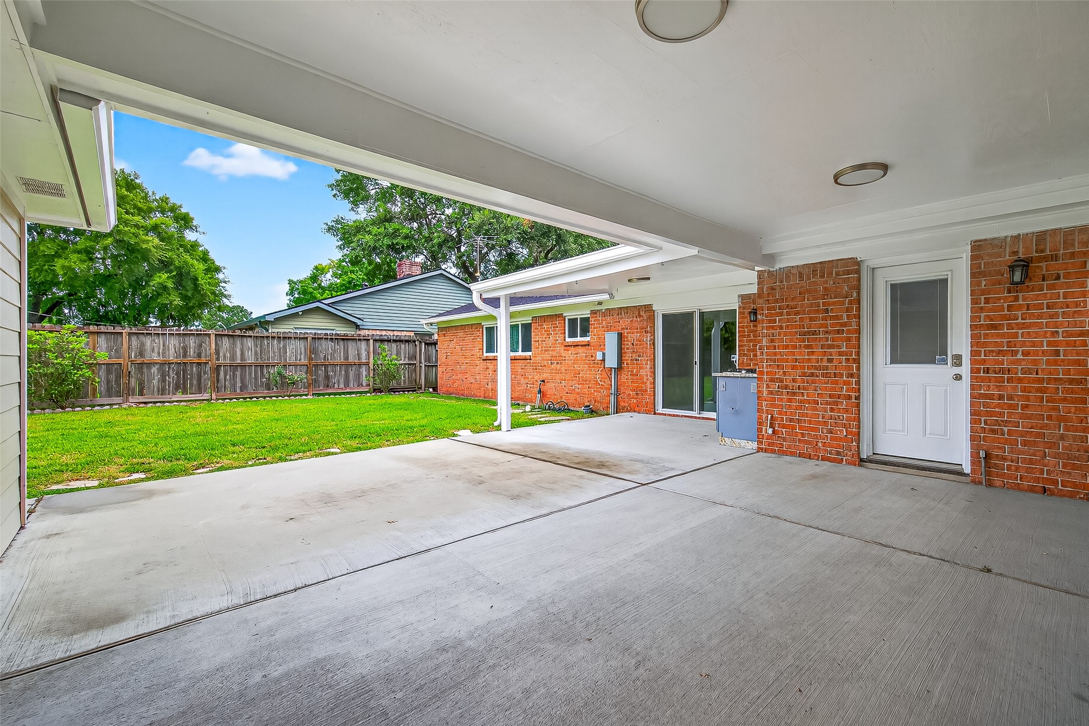 8530 Roos Road Houston, TX 77036 - Photo 39 of 43 a view of a house with a yard and garage