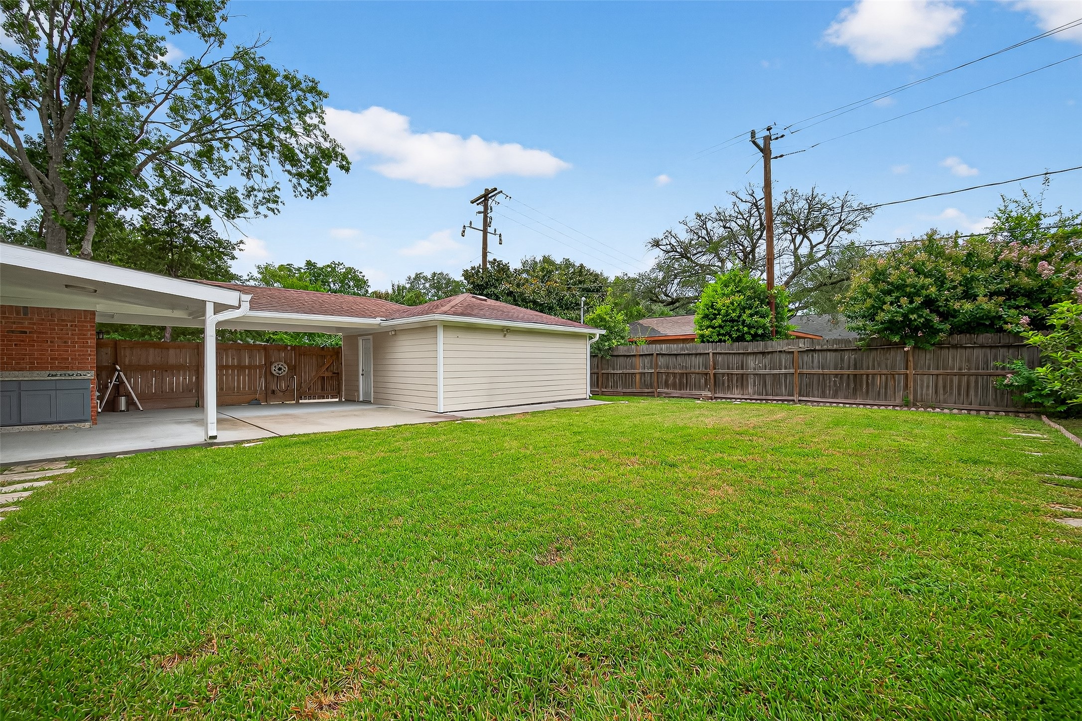 8530 Roos Road Houston, TX 77036 - Photo 43 of 43 a view of a backyard with plants and a garden