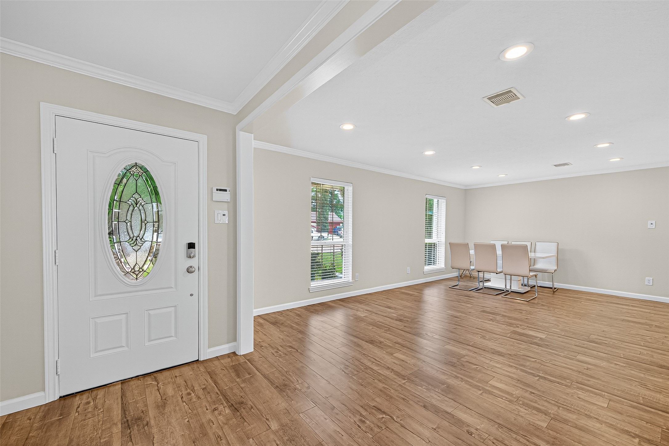 8530 Roos Road Houston, TX 77036 - Photo 5 of 43 a view of empty room with wooden floor and window