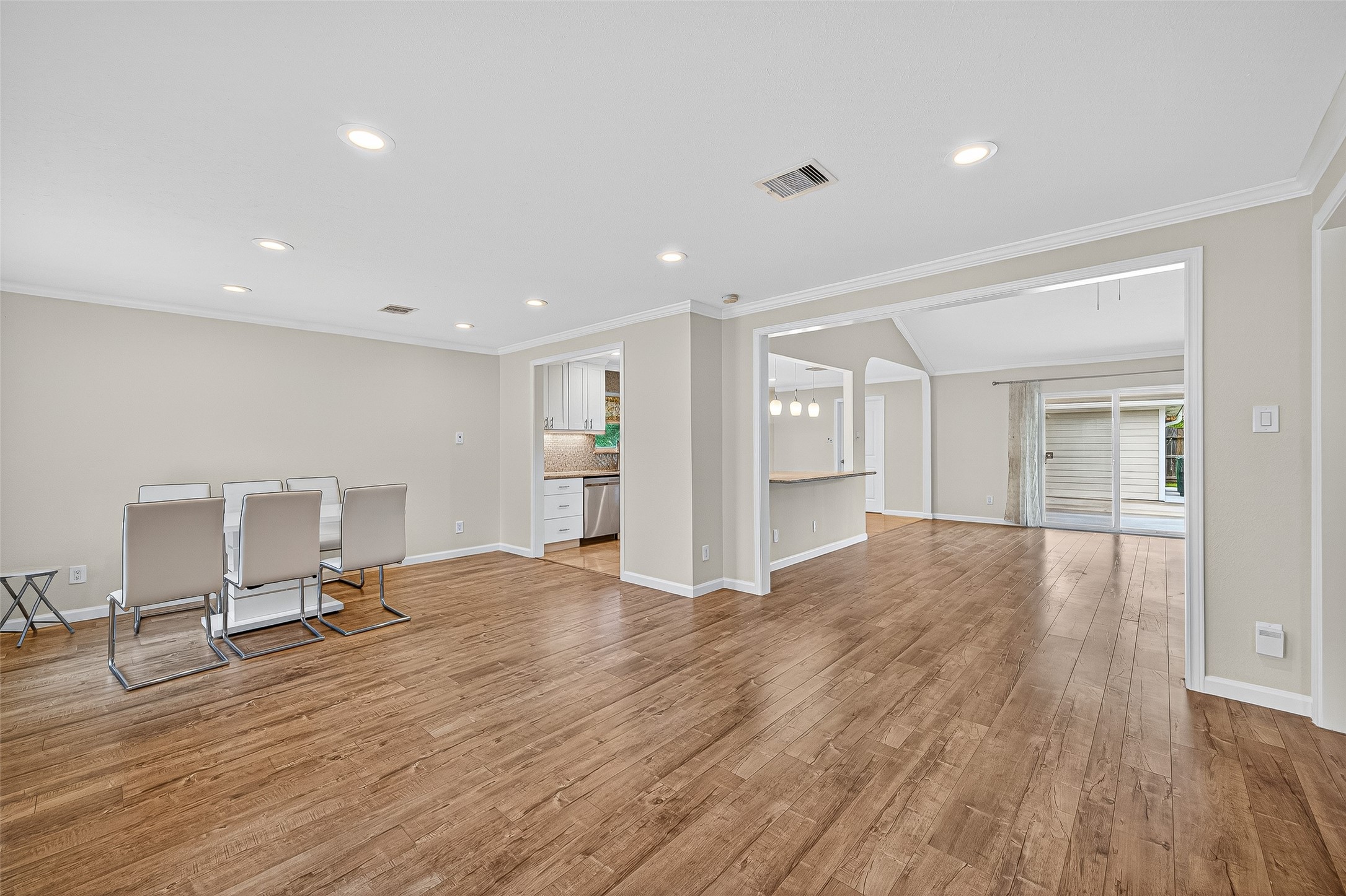 8530 Roos Road Houston, TX 77036 - Photo 6 of 43 a view of a livingroom with a furniture and wooden floor