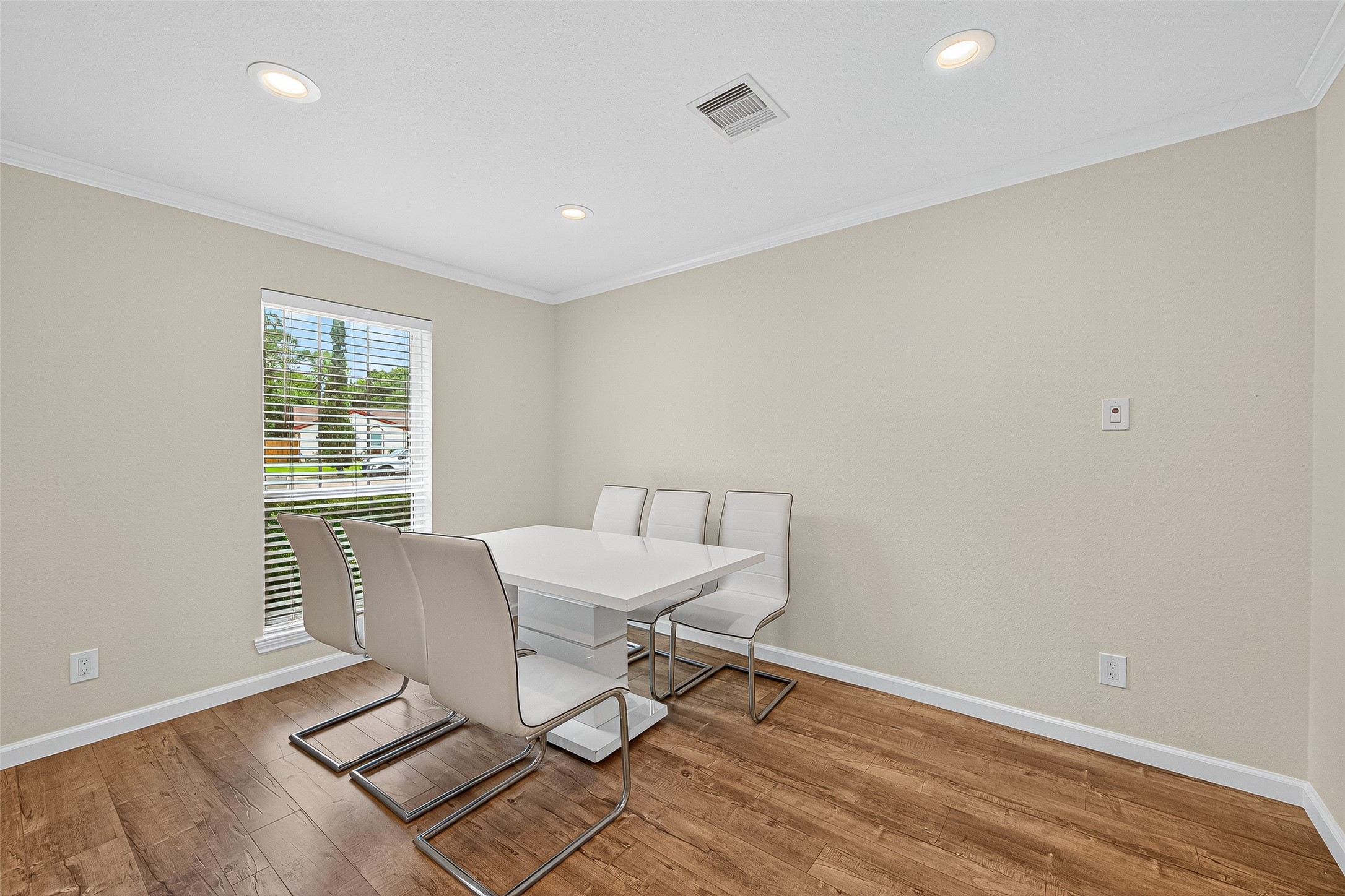 8530 Roos Road Houston, TX 77036 - Photo 10 of 43 a view of a work space with wooden floor and a window