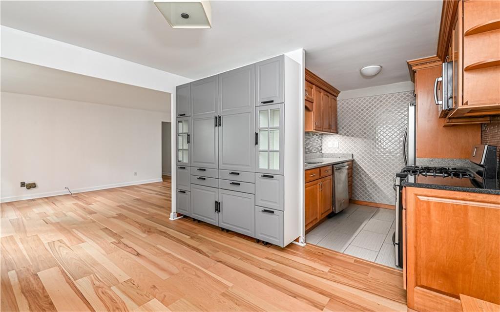 4601 Fifth Avenue, Unit 322 Pittsburgh, PA 15213 - Photo 13 of 27 a kitchen with stainless steel appliances a stove and a refrigerator
