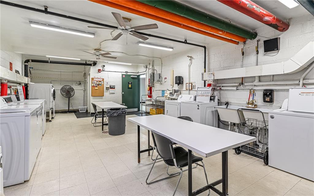 4601 Fifth Avenue, Unit 322 Pittsburgh, PA 15213 - Photo 18 of 18 a kitchen with a sink a stove and chairs