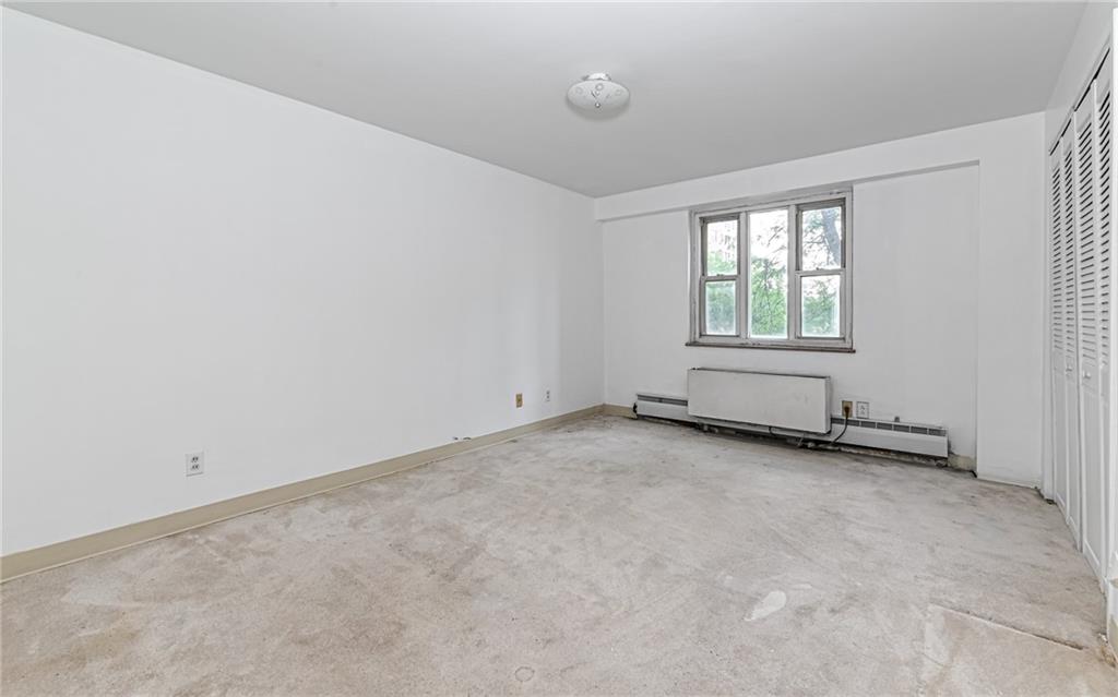 4601 Fifth Avenue, Unit 322 Pittsburgh, PA 15213 - Photo 21 of 27 an empty room with windows