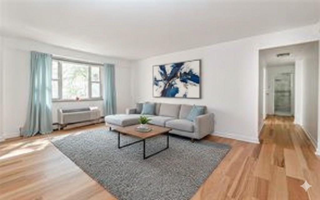 4601 Fifth Avenue, Unit 322 Pittsburgh, PA 15213 - Photo 7 of 27 a living room with furniture and a window