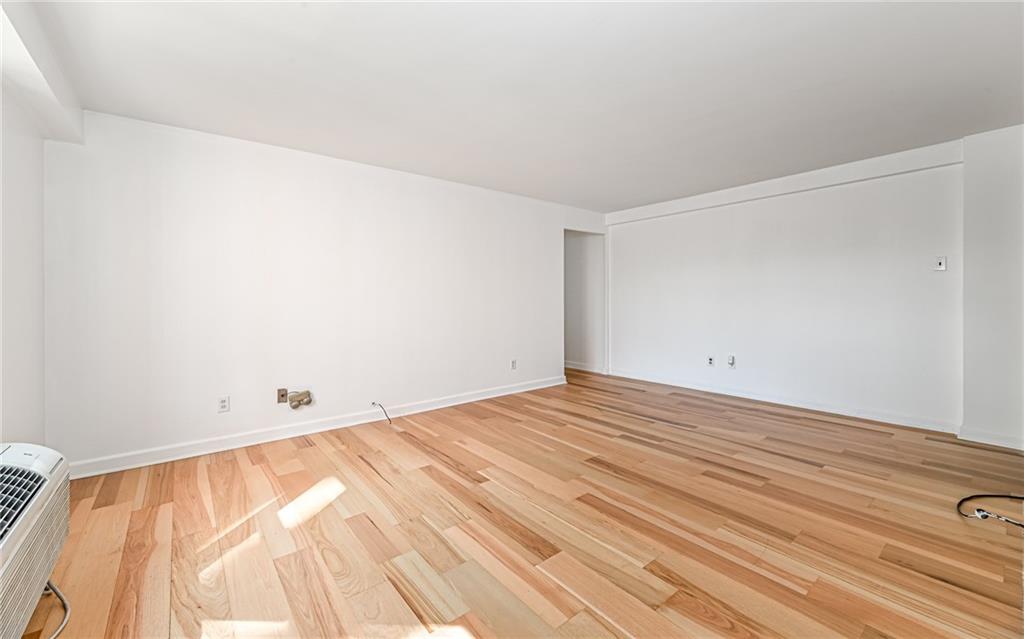 4601 Fifth Avenue, Unit 322 Pittsburgh, PA 15213 - Photo 7 of 18 a view of empty room with wooden floor