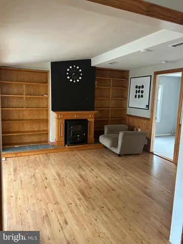 a view of a livingroom with furniture and a fireplace