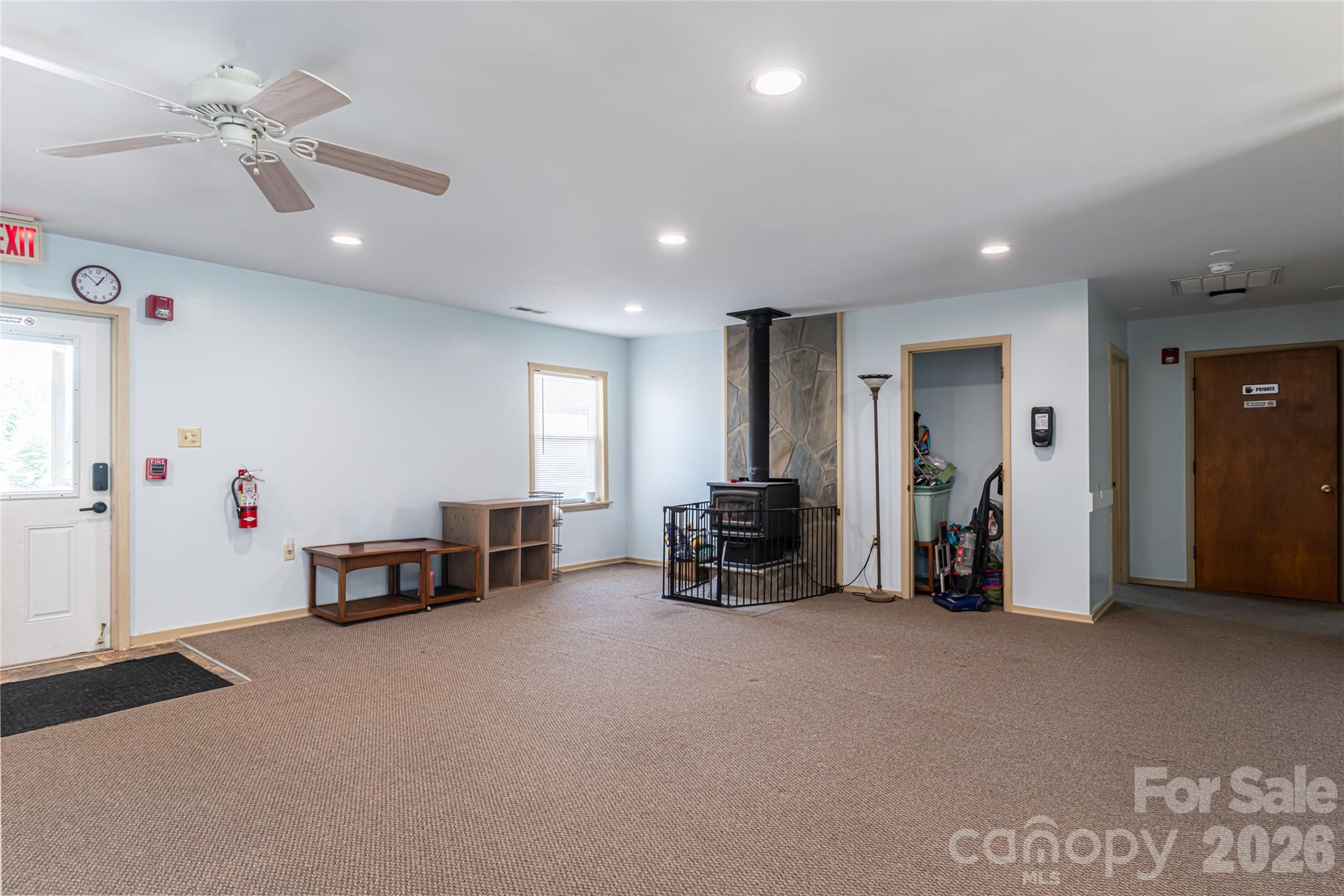 2800 Coxe Road Tryon, NC 28782 - Photo 30 of 40 a view of a livingroom with furniture and a ceiling fan