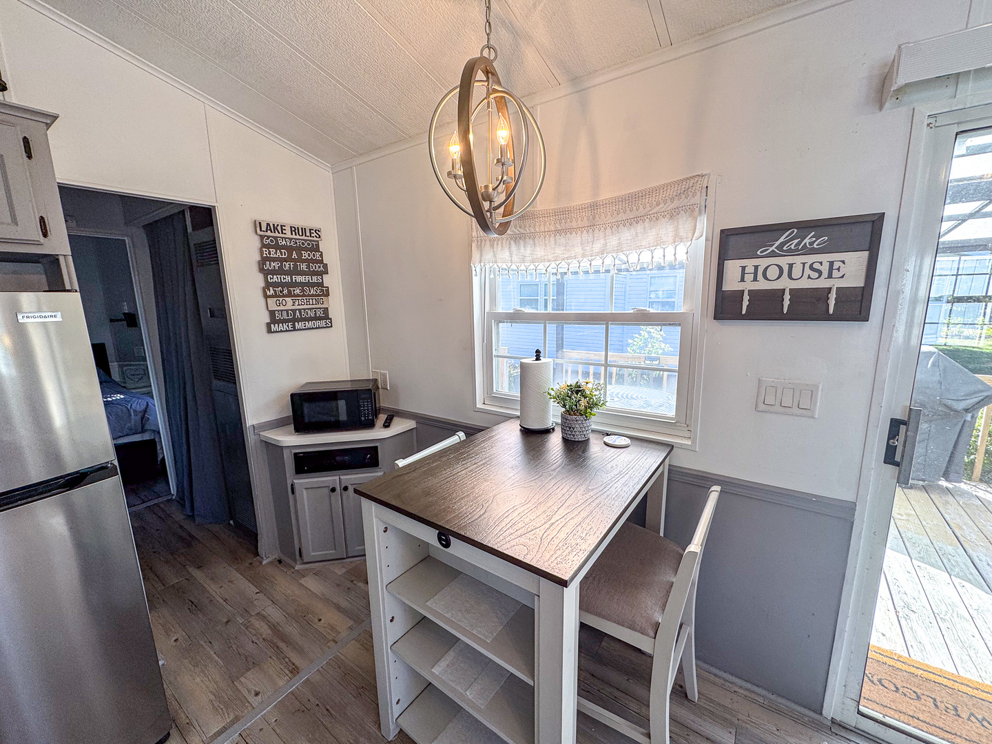 4-2 Woodhaven Sublette, IL 61367 - Photo 19 of 27 a view of a dining room with furniture window and wooden floor