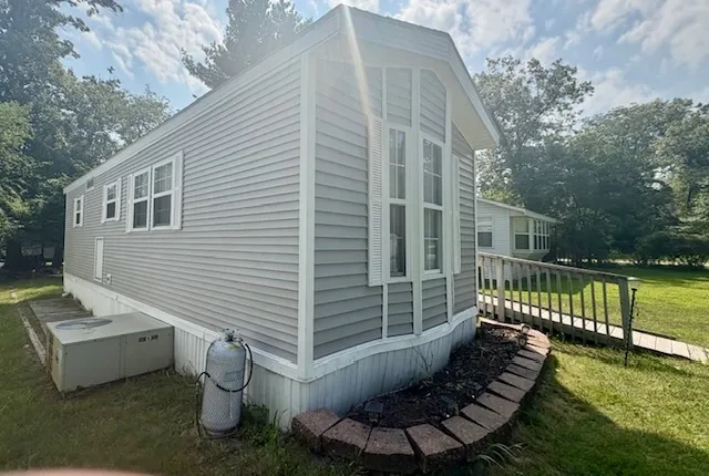 a view of a chair and tables in the backyard