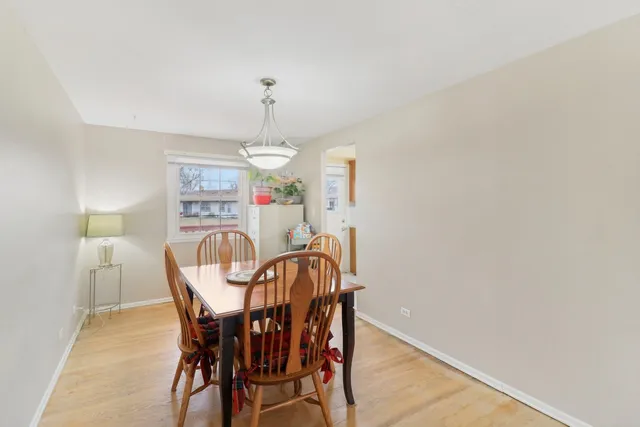 a view of a dining room with furniture and window