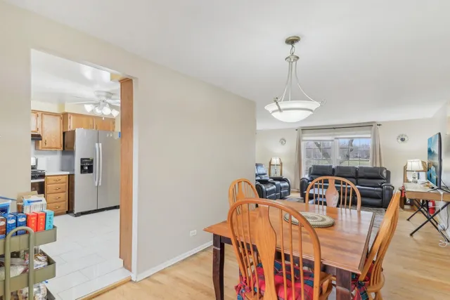 a view of a dining room with furniture and chandelier