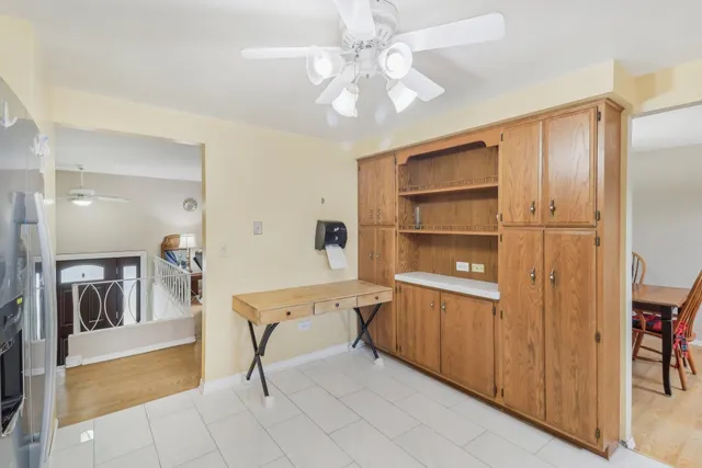 a view of a livingroom with a furniture and a ceiling fan