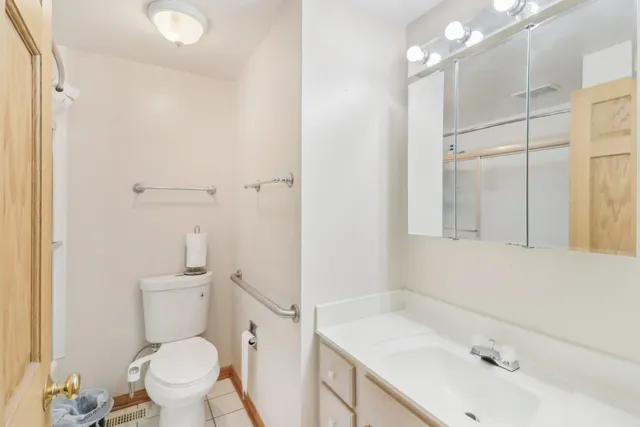 a bathroom with a glass shower door