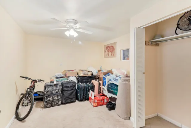 a view of a deck with chairs and wooden floor