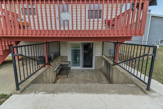 a view of a house with a swimming pool and sitting area