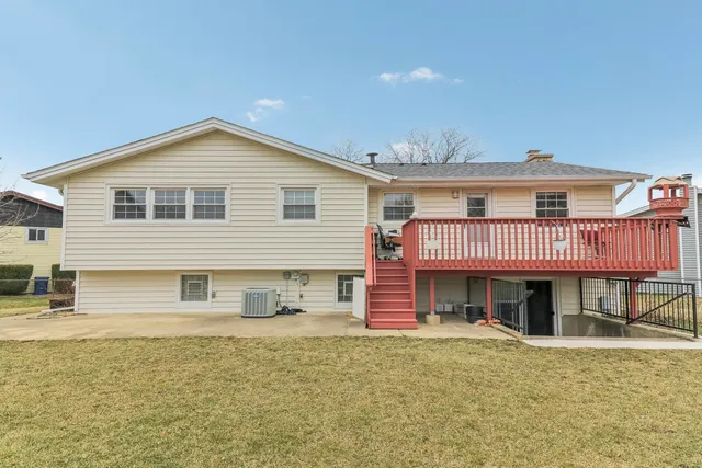 a view of a house with a yard and garage