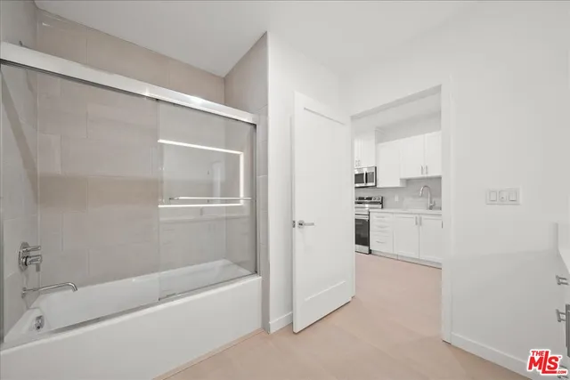 a bathroom with a bathtub and a sink