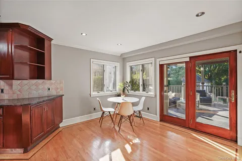 a view of a dining room with furniture window and outside view