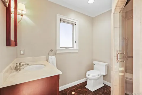 a bathroom with a sink toilet and vanity