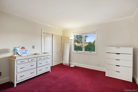 a view of room with window and cabinet