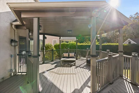 a view of a balcony with wooden floor