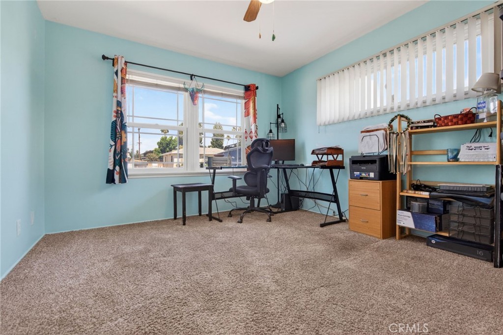 4194 Euclid Court Riverside, CA 92504 - Photo 19 of 29 Bedroom #3 with carpeting and ceiling fan.