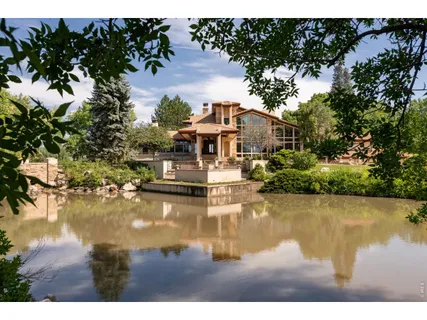 a swimming pool view with a lake view